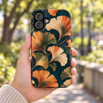 Adult woman holding the Nocturne Ginkgo case outdoors #iphone-16