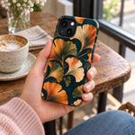 Adult woman holding the Nocturne Ginkgo iPhone 13 case at a cafe #iphone-13