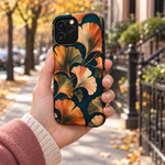 Adult woman holding the Nocturne Ginkgo iPhone 13 Pro Max case outdoors #iphone-13-pro-max