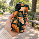 Adult woman holding the Nocturne Ginkgo iPhone 14 Plus case outdoors #iphone-14-plus