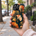 Adult woman holding the Nocturne Ginkgo iPhone 16 Pro case outdoors #iphone-16-pro