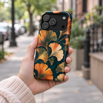 Adult woman holding the Nocturne Ginkgo iPhone 17 Pro case outdoors #iphone-17-pro