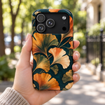 Adult woman holding the Nocturne Ginkgo iPhone 18 Pro case outdoors #iphone-18-pro