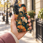 Adult woman holding the Nocturne Ginkgo Samsung Galaxy S26 case outdoors #samsung-galaxy-s26