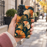 Adult woman holding the Nocturne Ginkgo Samsung Galaxy S26 Plus case outdoors #samsung-galaxy-s26-plus