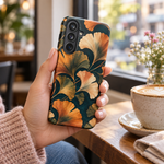 Adult woman holding the Nocturne Ginkgo Samsung Galaxy S26 Plus case at a cafe #samsung-galaxy-s26-plus