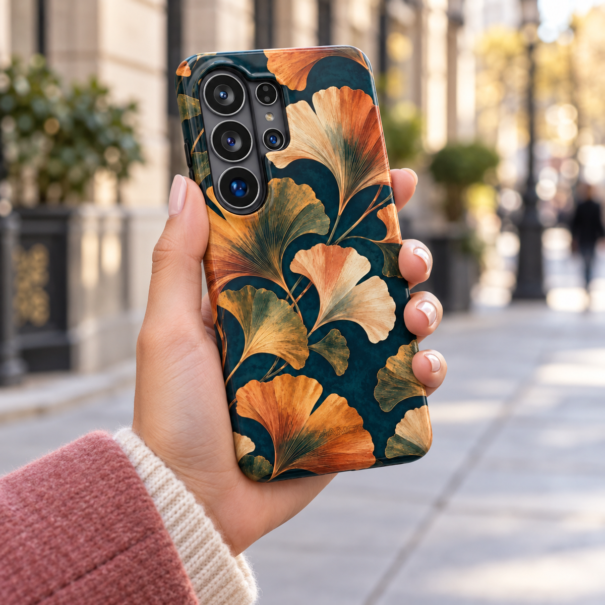 Adult woman holding the Nocturne Ginkgo Samsung Galaxy S26 Ultra case outdoors #samsung-galaxy-s26-ultra