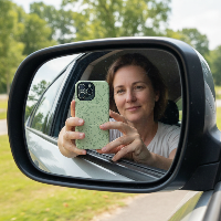 Outdoor car mirror selfie - woman in 40s